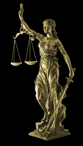 Que tient généralement l’allégorie de la Justice, de sa main qui ne tient pas le glaive ?